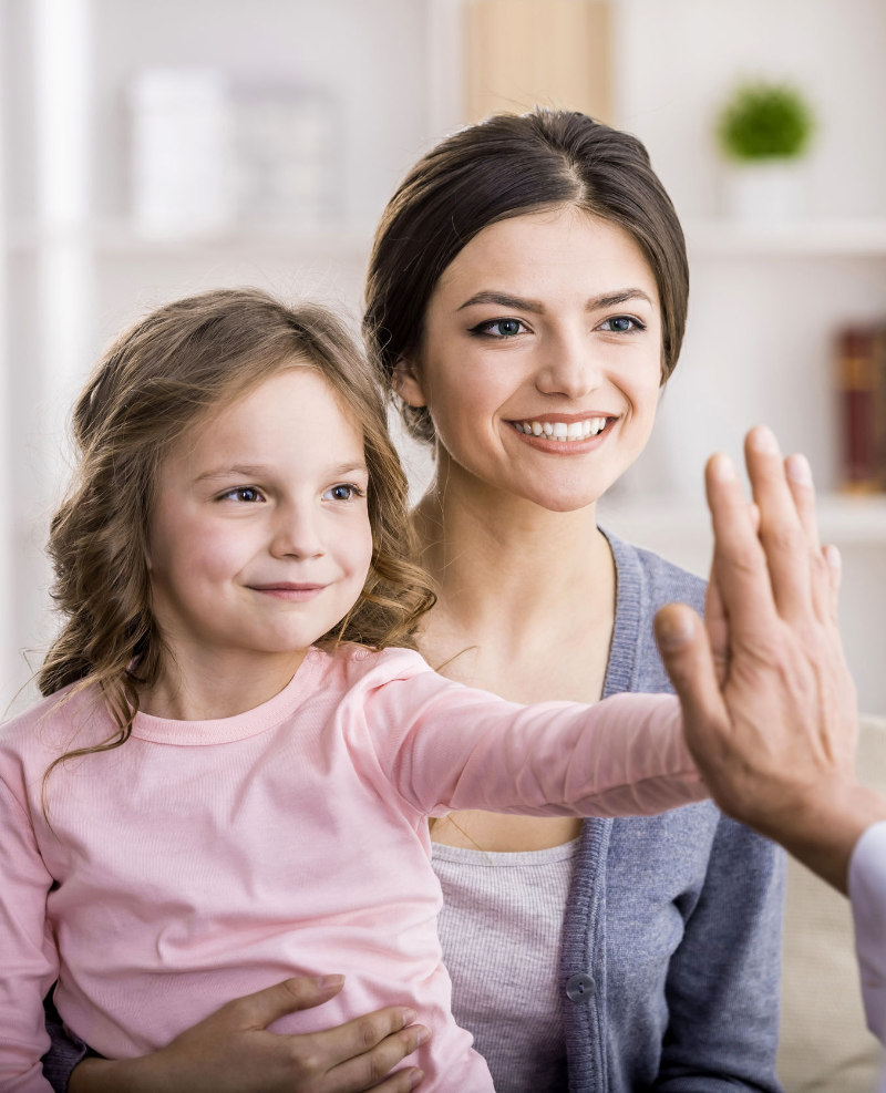 mother and daughter with audiologist