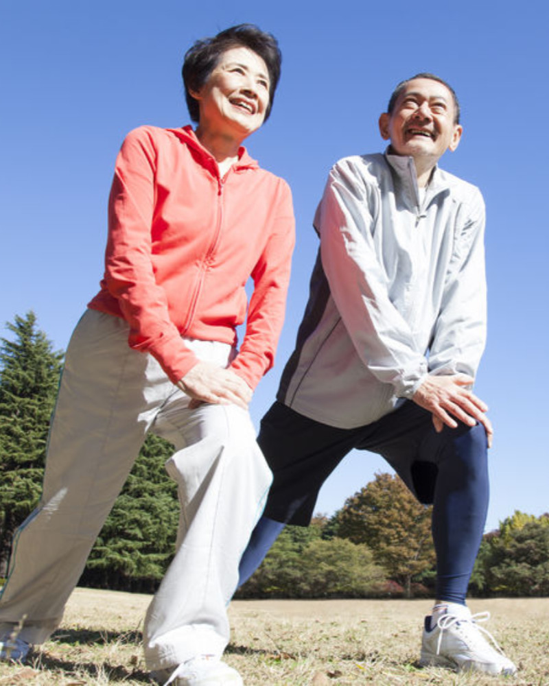 couple exercising at park